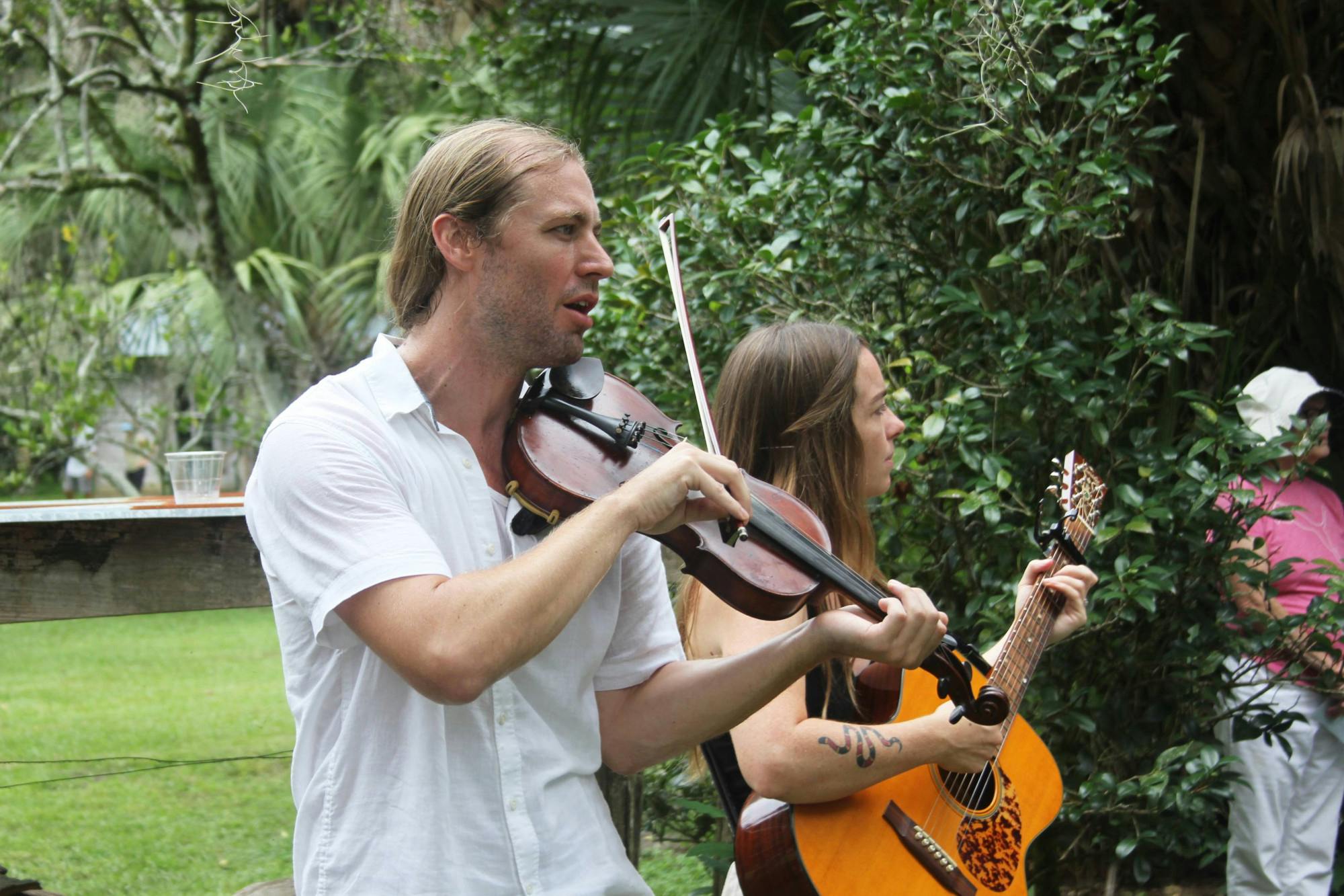 Eli Tragash (left) and Virginia Carr (right) perform with their band, The Front Porch Backsteppers, at the Marjorie Kinnan Rawlings Historic State Park on Saturday, August 5, 2023. 