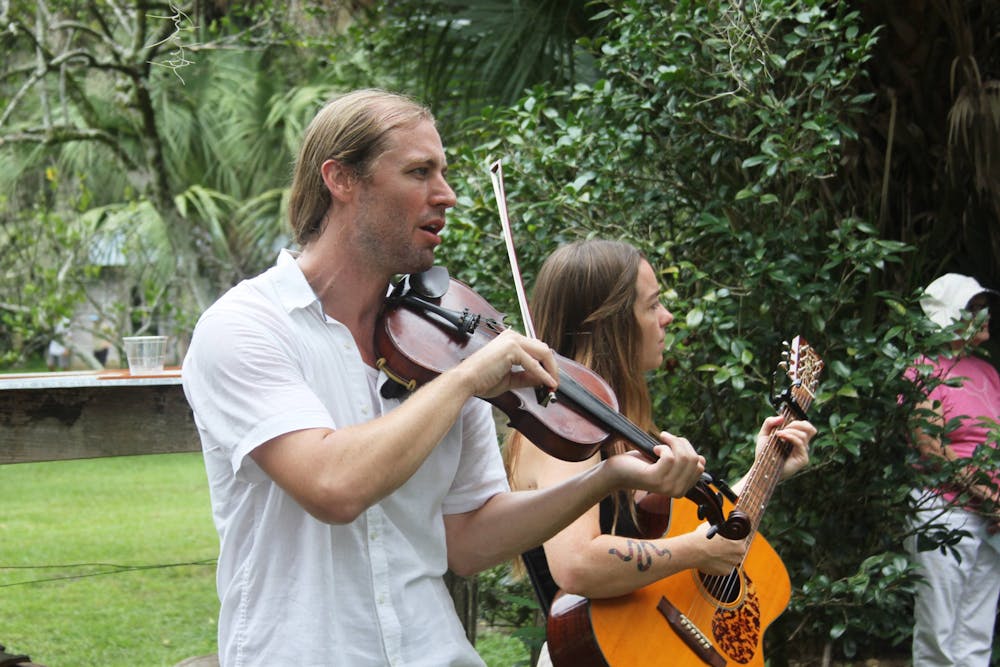 <p>Eli Tragash (left) and Virginia Carr (right) perform with their band, The Front Porch Backsteppers, at the Marjorie Kinnan Rawlings Historic State Park on Saturday, August 5, 2023. </p><p><br/><br/><br/></p>