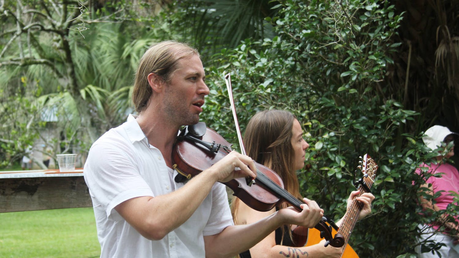 Eli Tragash (left) and Virginia Carr (right) perform with their band, The Front Porch Backsteppers, at the Marjorie Kinnan Rawlings Historic State Park on Saturday, August 5, 2023.