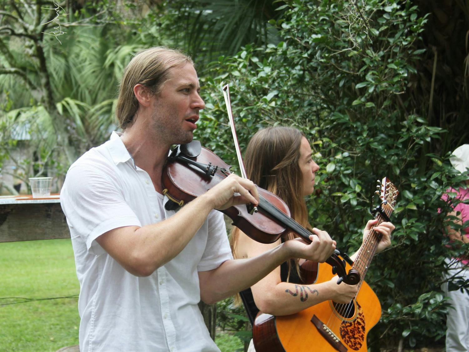 Eli Tragash (left) and Virginia Carr (right) perform with their band, The Front Porch Backsteppers, at the Marjorie Kinnan Rawlings Historic State Park on Saturday, August 5, 2023. 