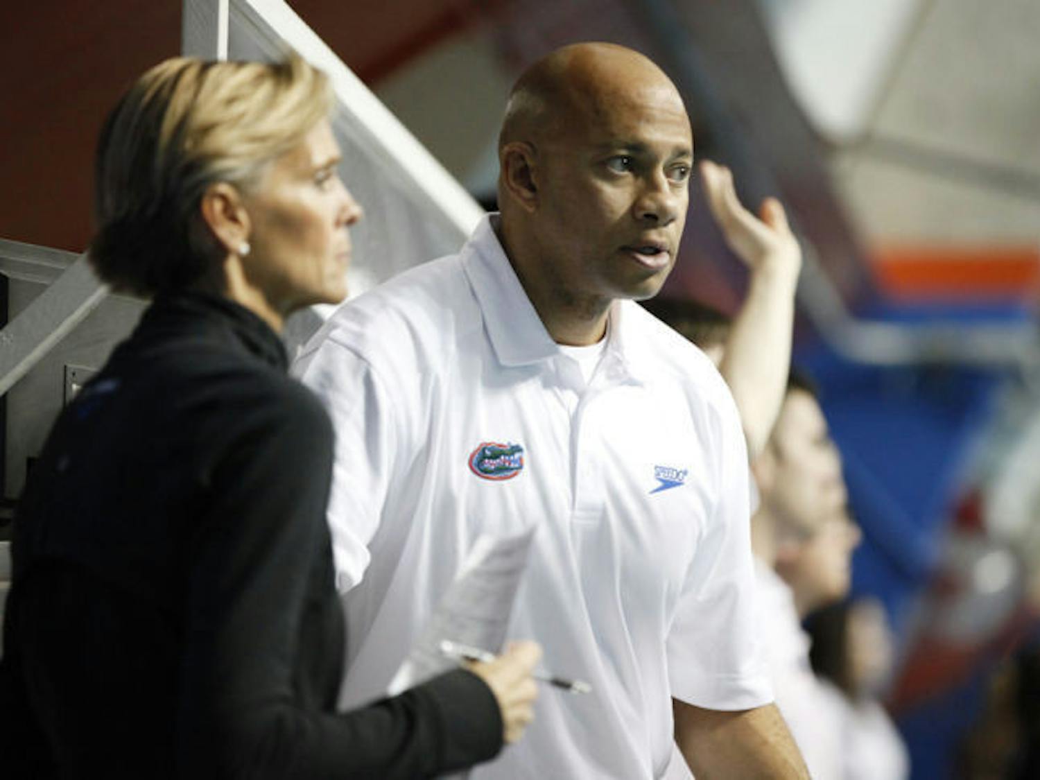 UF associate head coach Anthony Nesty (right) watches during Florida’s dual-meet sweep against Tennessee on Feb. 1 in the O’Connell Center. Nesty said the Gators need to excel in relays to win the SEC championship.
