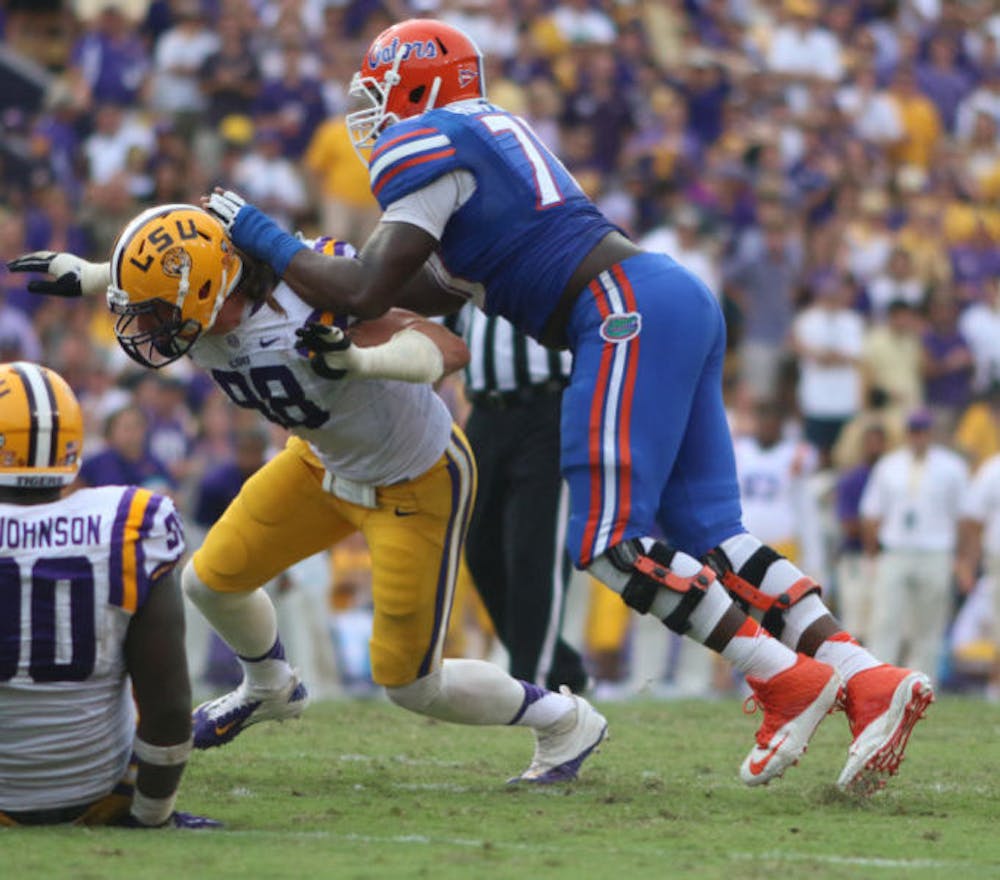 <p>D.J. Humphries (right) blocks LSU junior defensive end Jordan Allen during the Gators’ 17-6 loss to the Tigers on Saturday at Tiger Stadium in Baton Rouge, La. Florida allowed four sacks in the game.</p>