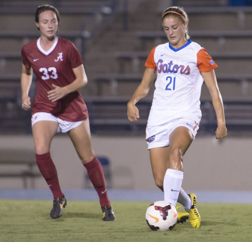 <p>Jillian Graff (21) dribbles past Alabama’s Abby Lutzenkirchen (33) during Florida’s 3-0 victory against Alabama on Sept. 20 at James G. Pressly Stadium. Graff has one goal this season.</p>