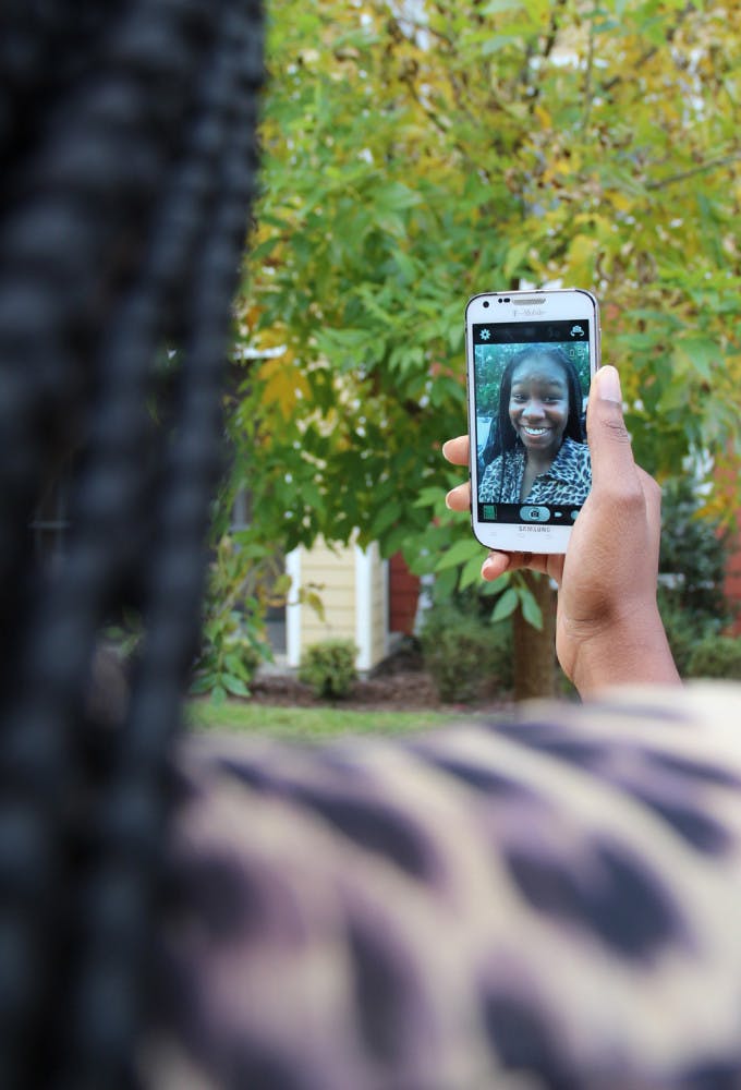 Jane Oni, a 20-year-old UF family, youth and community sciences junior, poses for a selfie Tuesday afternoon.