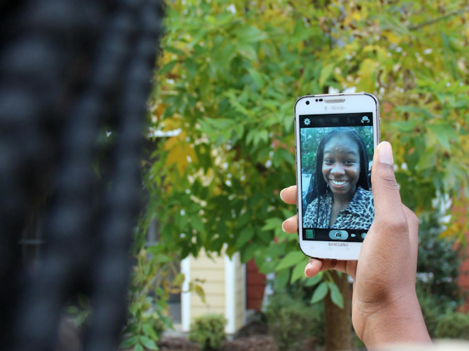 Jane Oni, a 20-year-old UF family, youth and community sciences junior, poses for a selfie Tuesday afternoon.