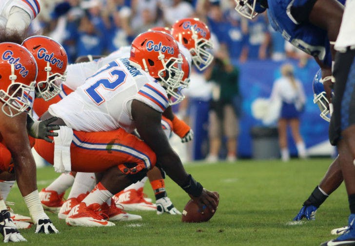 Jon Harrison prepares to snap the ball during Florida’s 24-7 victory against Kentucky on Saturday at Commonwealth Stadium in Lexington, Ky. Behind the Gators’ dominant offensive line, running back Matt Jones rushed for a career-high 176 yards against the Wildcats. Florida will face a talented Arkansas defense on Saturday at 7 p.m. in Ben Hill Griffin Stadium.