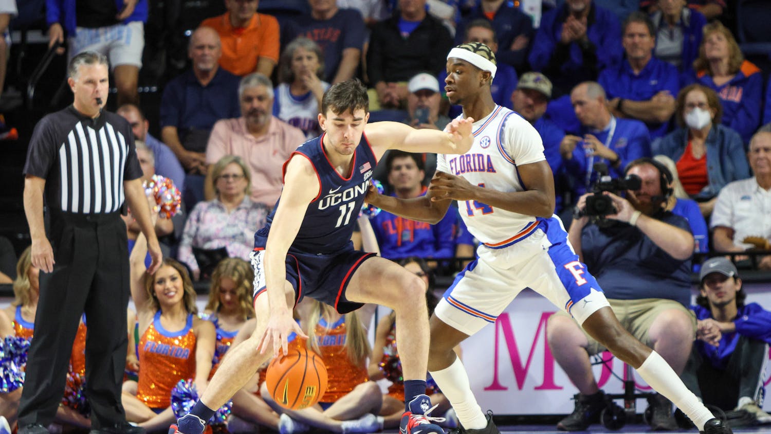 Florida guard Kowacie Reeves plays defense against a Connecticut player in the Gators’ 75-54 loss to the Huskies Wednesday, Dec. 7, 2022.