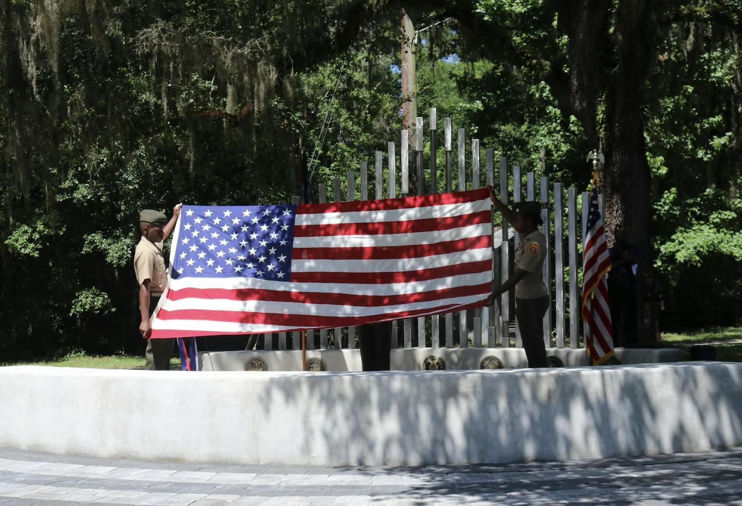 Milton Lewis Young Marines conducts the flag ceremony on Memorial Day at the Evergreen Cemetery May 30, 2022.
