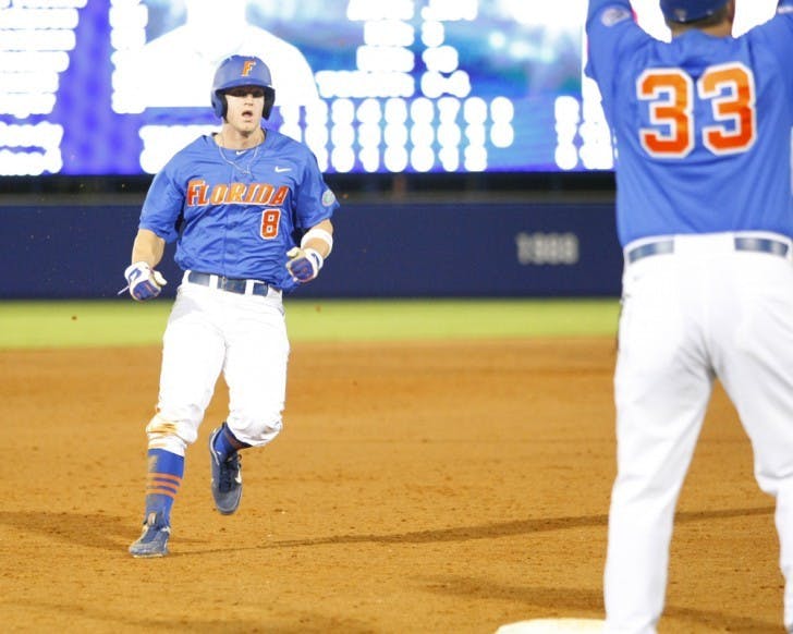 Senior outfielder Daniel Pigott (8) failed to tag up from third base and score the tying run after Preston Tucker hit a fly ball to right field in the bottom of the ninth inning in No. 1 Florida’s 7-6 loss No. 12 LSU.