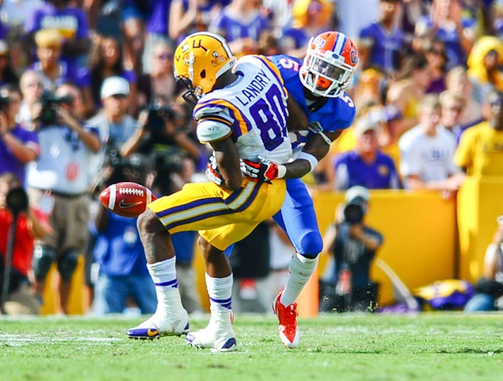 <p>Marcus Roberson (5) tackles Tigers wide receiver Jarvis Landry (80) during Florida’s 17-6 loss to LSU on Oct. 12 at Tiger Stadium in Baton Rouge, La.</p>