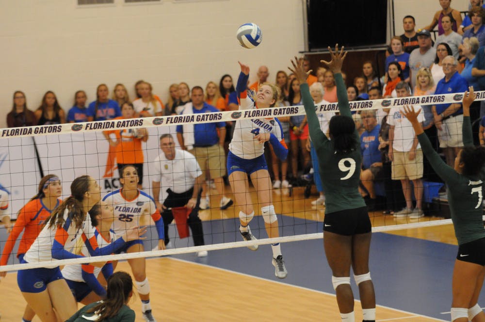 UF outside hitter Carli Snyder slams down a kill attempt during Florida's 3-0 win against Jacksonville on Sept. 16, 2016, inside the Lemerand Athletic Center.