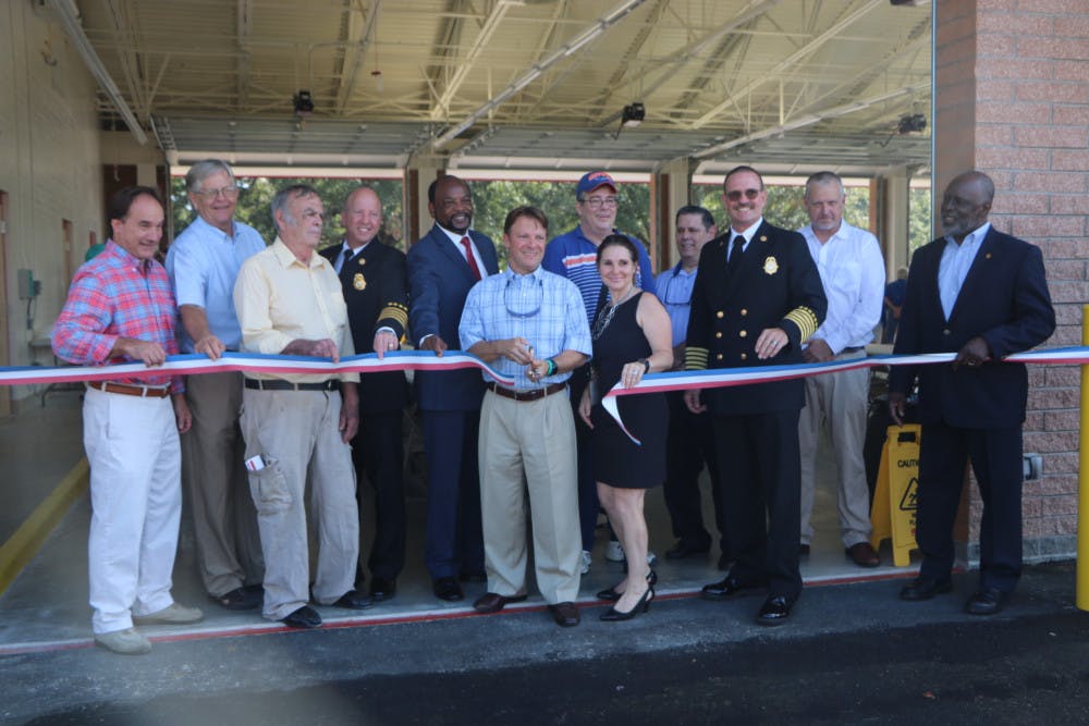 Alachua County Commissioner Ken Cornell cuts the ribbon in front of the new Fire Rescue Station 33, located at 5901 NW 34th Blvd., on Friday. The station will house six ambulances.