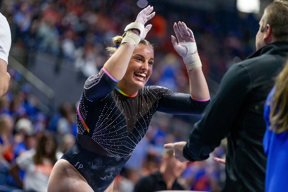 Skylar Draser beams with excitement after her uneven parallel bars routine  during the 2024 NCAA Gymnastics Gainesville Regional Finals on Sunday, April 7. 