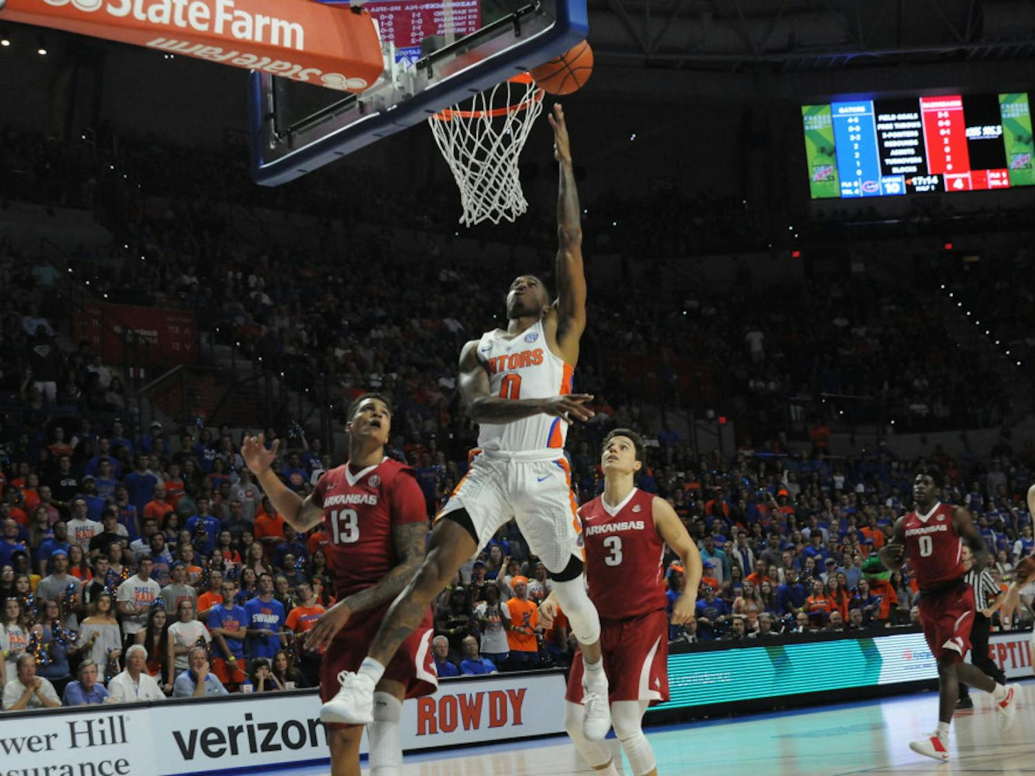 UF guard Kasey Hill attempts a layup in Florida's 78-65 win over Arkansas on Wednesday at the O'Connell Center.&nbsp;