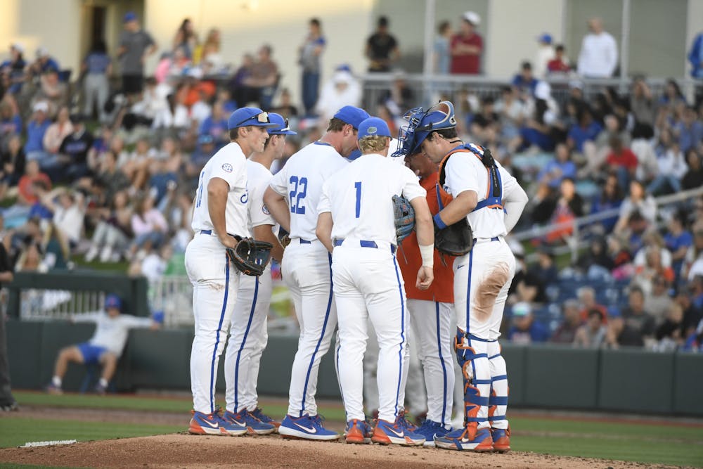 Florida baseball head coach Kevin O'Sullivan talks to his team during a mound visit in the Gators' loss to the South Carolina Gamecocks on Friday, April 12, 2024. 