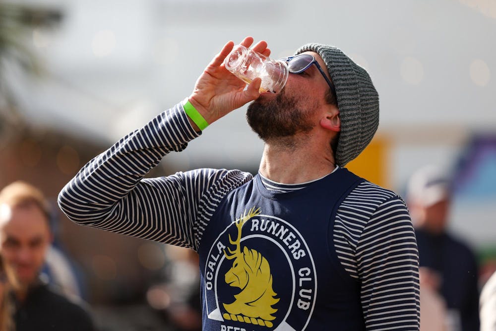 Gainesville Beer Mile winner Adam Truesdale drinks his final beer of the race on Saturday, Jan. 31, 2026.