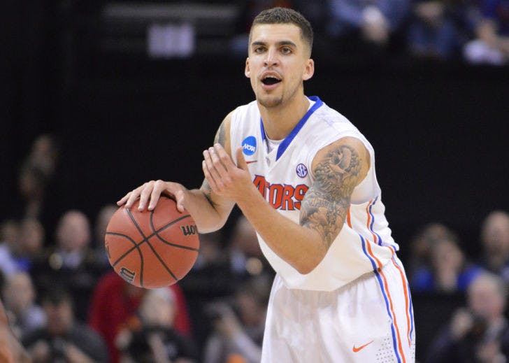 Scottie Wilbekin calls out a play to his teammates during Florida’s 62-52 win against Dayton on Saturday in FedExForum. Wilbekin was named the Most Outstanding Player of the South Region of the NCAA Tournament after the Gators defeated the Flyers.