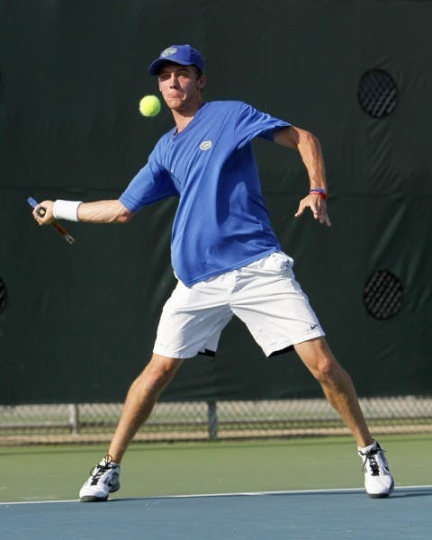 UF senior Bob van Overbeek returns a volley. Van Overbeek won only his second match since Feb. 3 against Ole Miss on Friday.