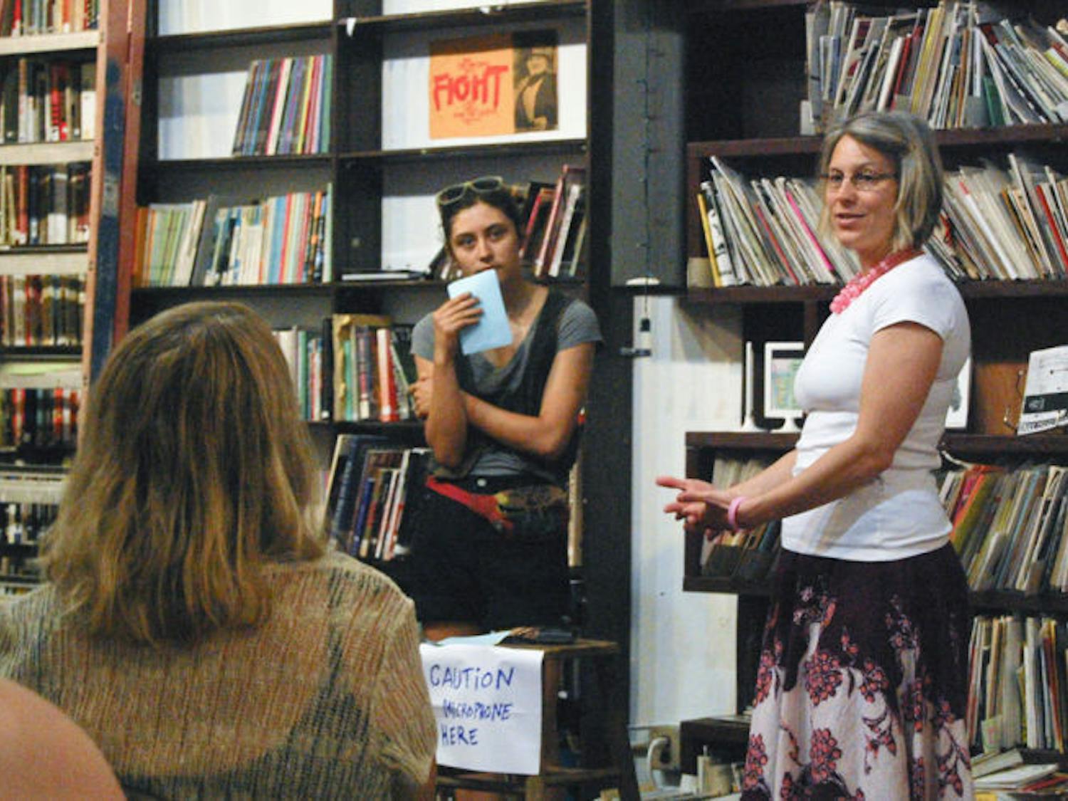 Citizens Co-op general manager Lisa McNett addresses co-op members Sunday at a membership meeting held at the Civic Media Center downtown. McNett said because board members are stepping down for a June 24 election, the membership has an opportunity to find common ground for the co-op.