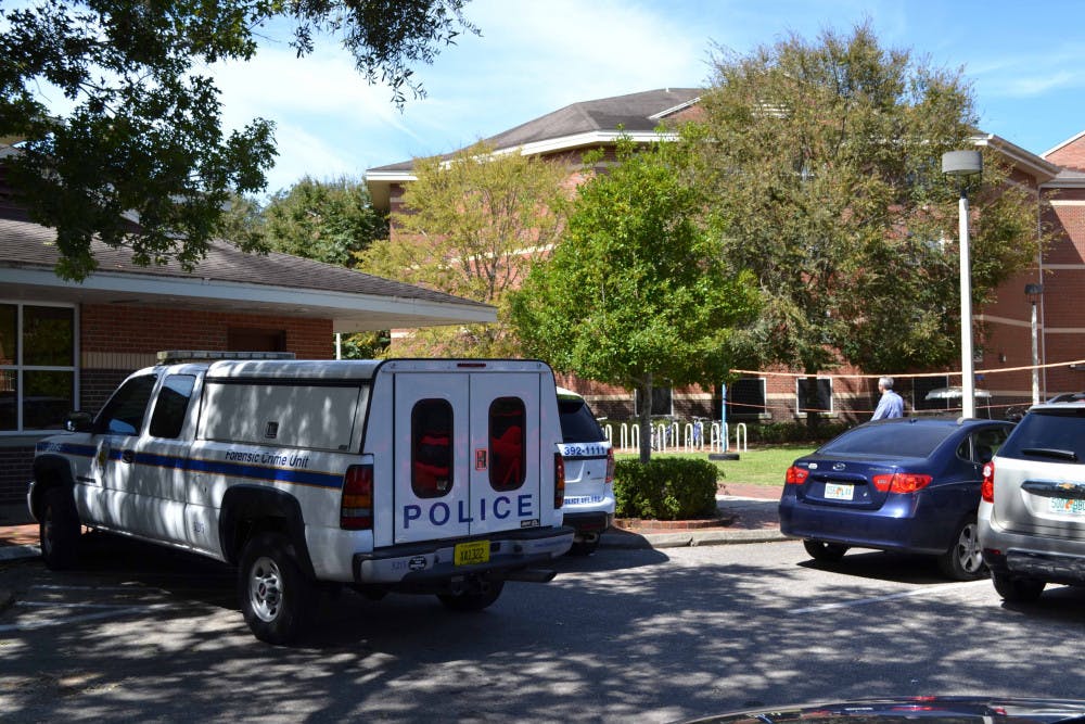 <p>A Gainesville Police Department forensic crime unit vehicle is parked outside of UF's Springs Residential Complex on Monday afternoon.</p>