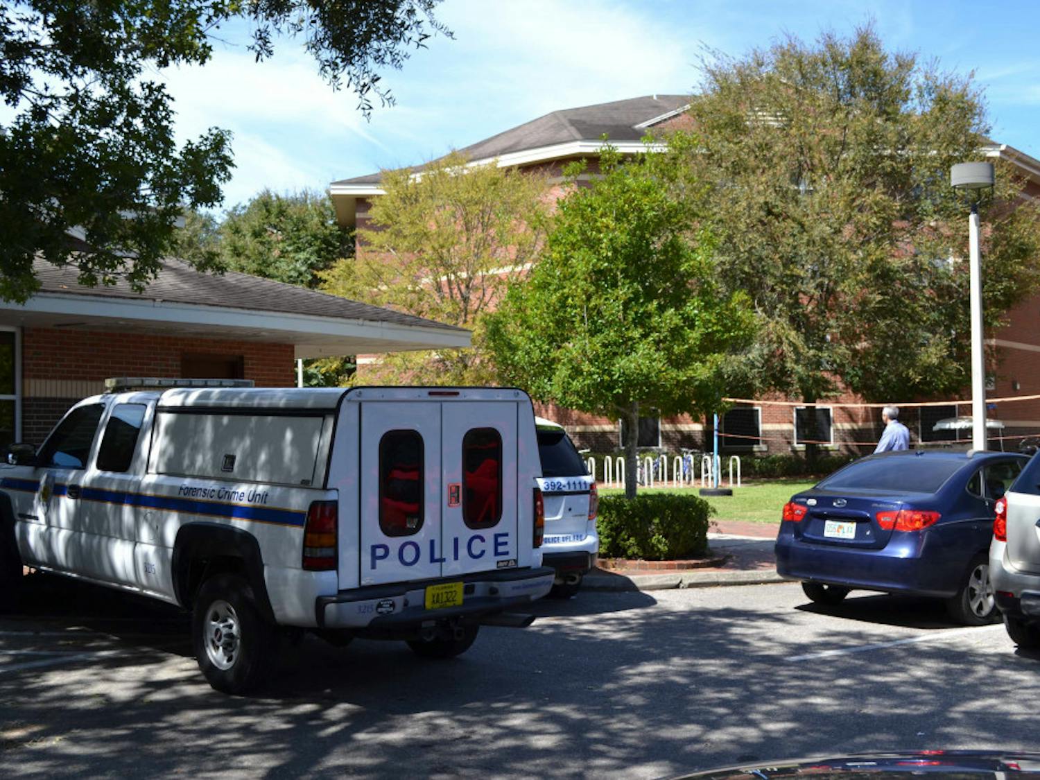 A Gainesville Police Department forensic crime unit vehicle is parked outside of UF's Springs Residential Complex on Monday afternoon.