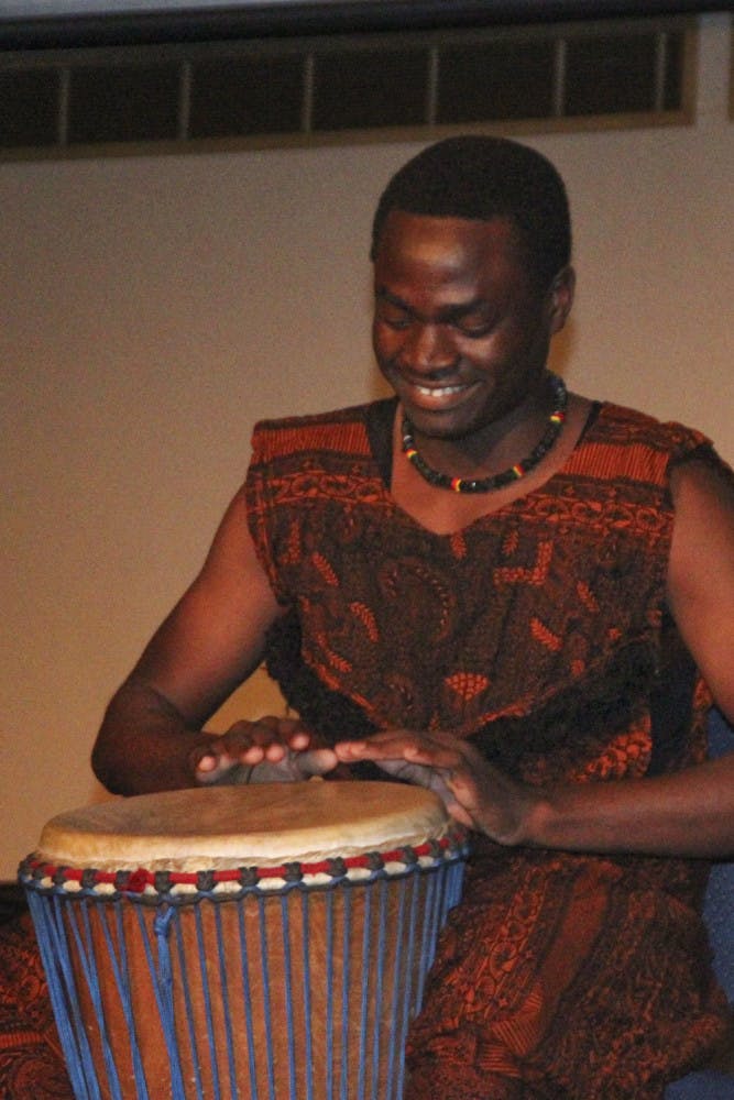 Mussa Nturubika, a 19-year-old UF health science freshman, plays the djembe, a western African drum made of cow skin, in the talent portion of the African Student Union pageant in the Reitz Union Grand Ballroom on Nov. 11, 2015. He competed representing the Democratic Republic of the Congo for the title of Mr. African Student Union.