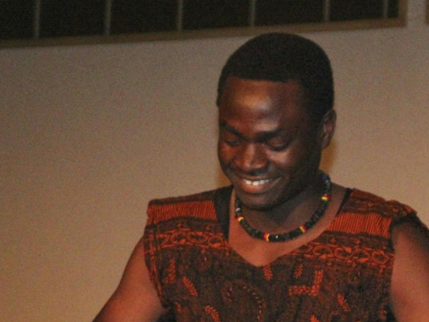 Mussa Nturubika, a 19-year-old UF health science freshman, plays the djembe, a western African drum made of cow skin, in the talent portion of the African Student Union pageant in the Reitz Union Grand Ballroom on Nov. 11, 2015. He competed representing the Democratic Republic of the Congo for the title of Mr. African Student Union.