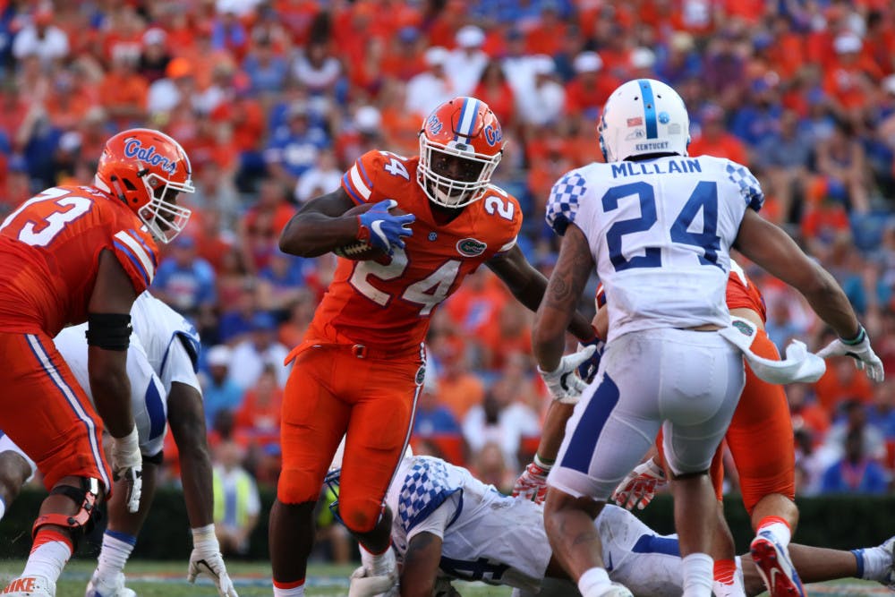 <p>Florida's Mark Thompson (24) runs with the ball during UF's 45-7 win over Kentucky on Sept. 10, 2016, at Ben Hill Griffin Stadium.</p>