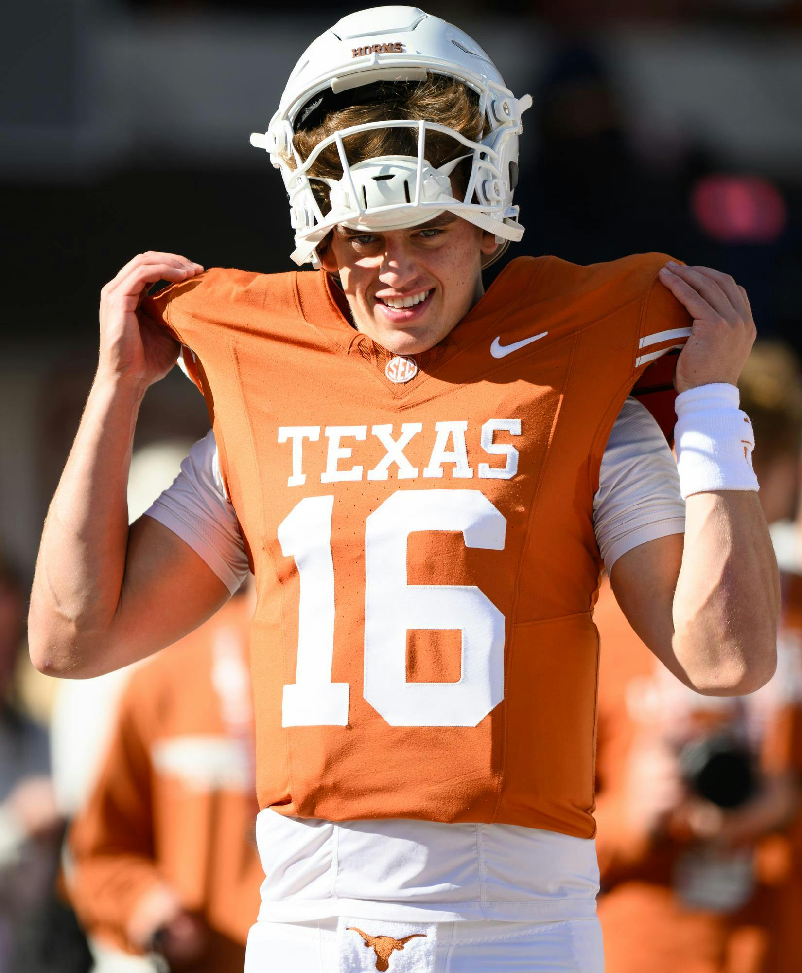 Texas quarterback Arch Manning adjusts his jersey before an NCAA college football game against Florida, Friday, Oct. 16, 2026, in Austin, Texas.
