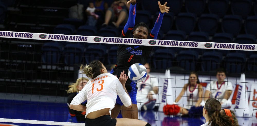 Rhamat Alhassan jumps up to block the ball during Florida's 3-0 win against Florida A&amp;M on Sept. 15, 2017, at the O'Connell Center.