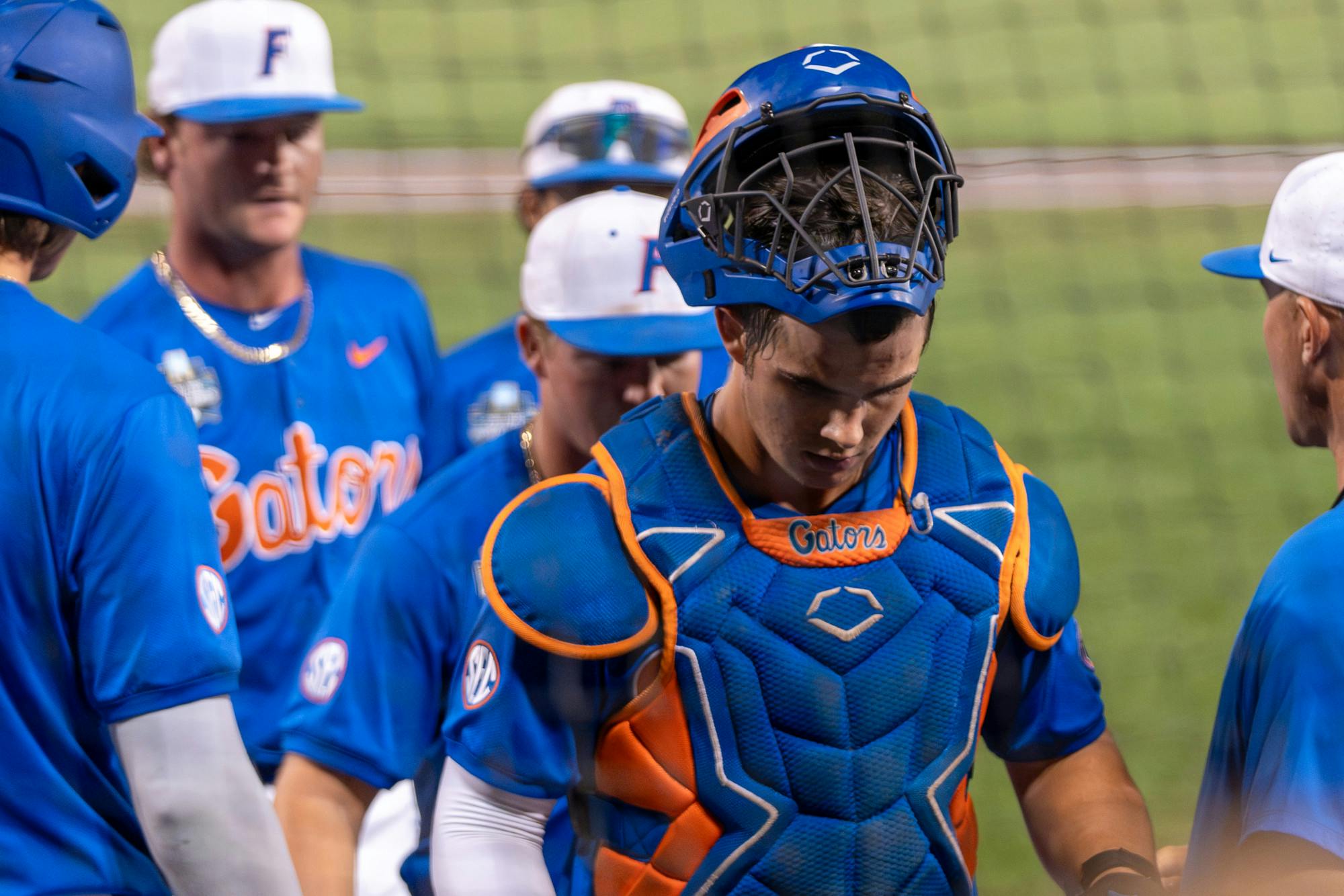 Florida catcher Luke Heyman walks off the field after losing their first College World Series game to Texas A&amp;M on Saturday, June 15, 2024.