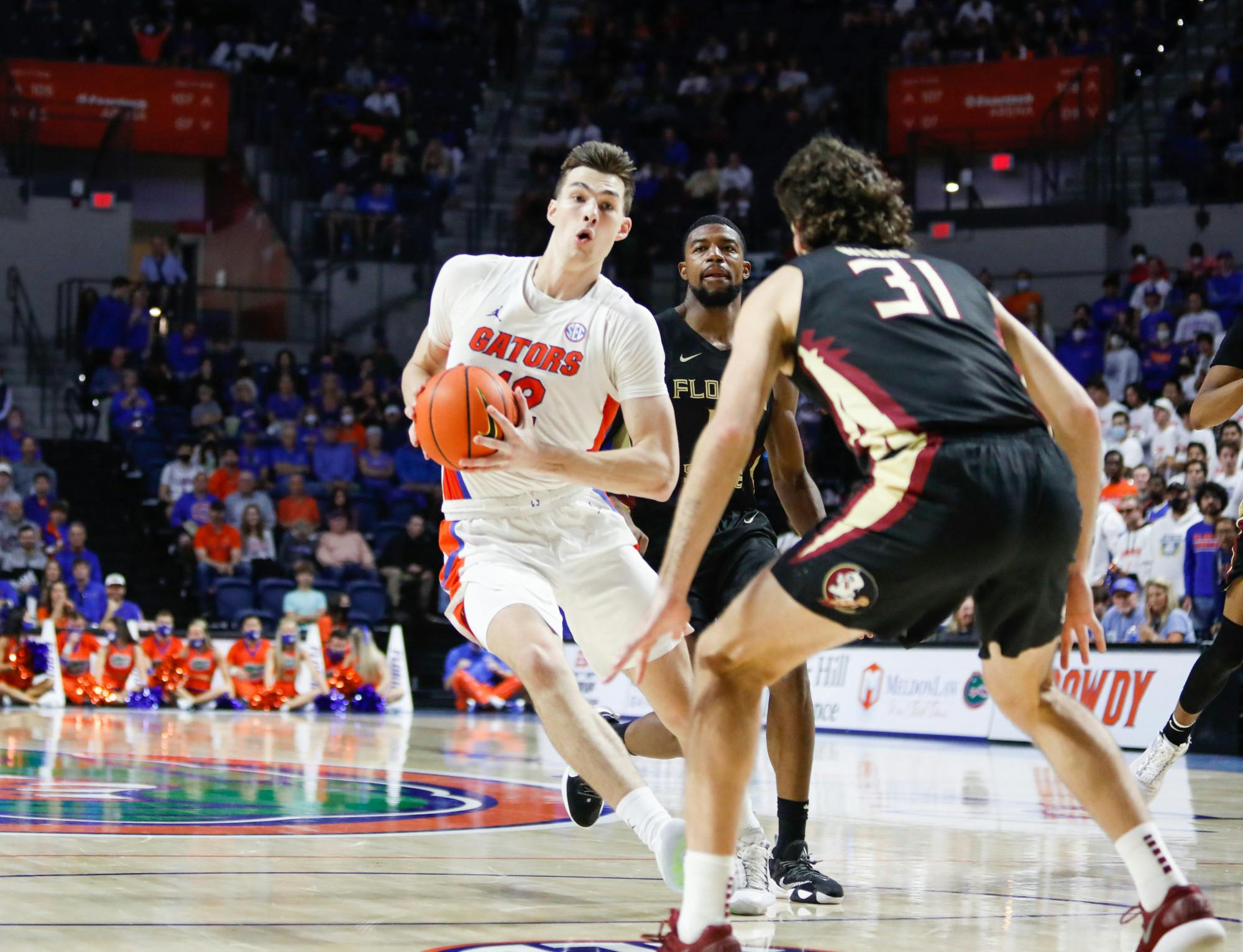 Florida&#x27;s Colin Castleton takes the ball up the court during a Nov. 14 game against Florida State. Castleton led the Gators in points and minutes played Saturday in a crucial victory over Ole Miss.