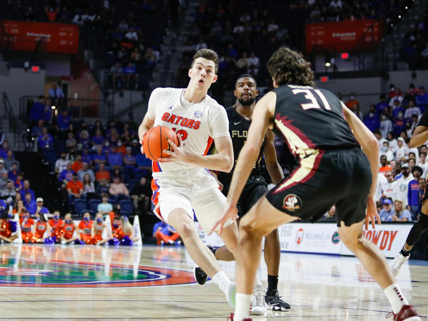 Florida&#x27;s Colin Castleton takes the ball up the court during a Nov. 14 game against Florida State. Castleton led the Gators in points and minutes played Saturday in a crucial victory over Ole Miss.