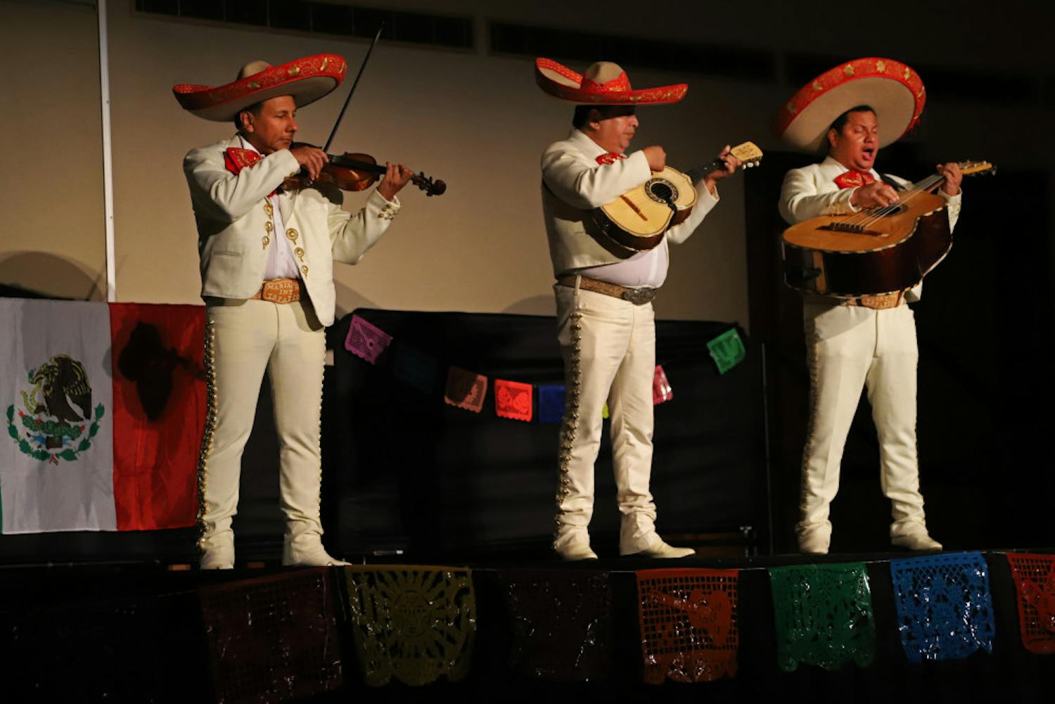 Mariachi members celebrate the living and dead Friday night at the Día de Los Muertos event put on by the UF Mexican-American Student Association and GatorNights. In addition to live music, the event also offered food, crafts and face painting. 