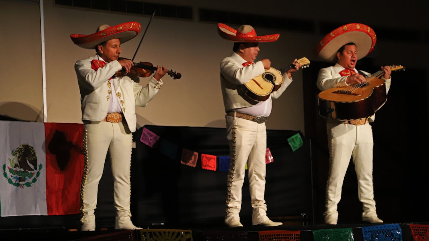 Mariachi members celebrate the living and dead Friday night at the Día de Los Muertos event put on by the UF Mexican-American Student Association and GatorNights. In addition to live music, the event also offered food, crafts and face painting. 