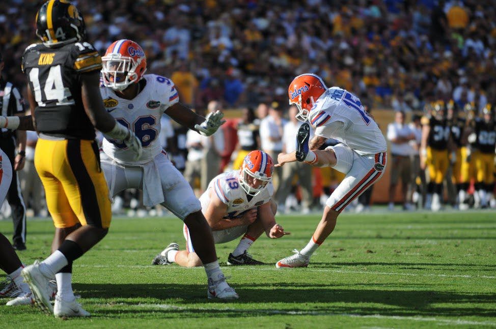 Florida kicker Eddy Pineiro attempts a field goal during UF's 30-3 win over Iowa in the Outback Bowl Monday at Raymond James Stadium.&nbsp;