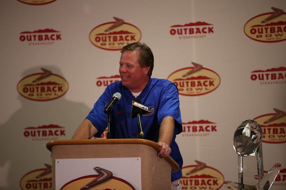 <p>UF coach Jim McElwain smiles during a press conference after Florida's 30-3 win over Iowa in the Outback Bowl on Jan. 2, 2017, at Raymond James Stadium in Tampa.&nbsp;</p>