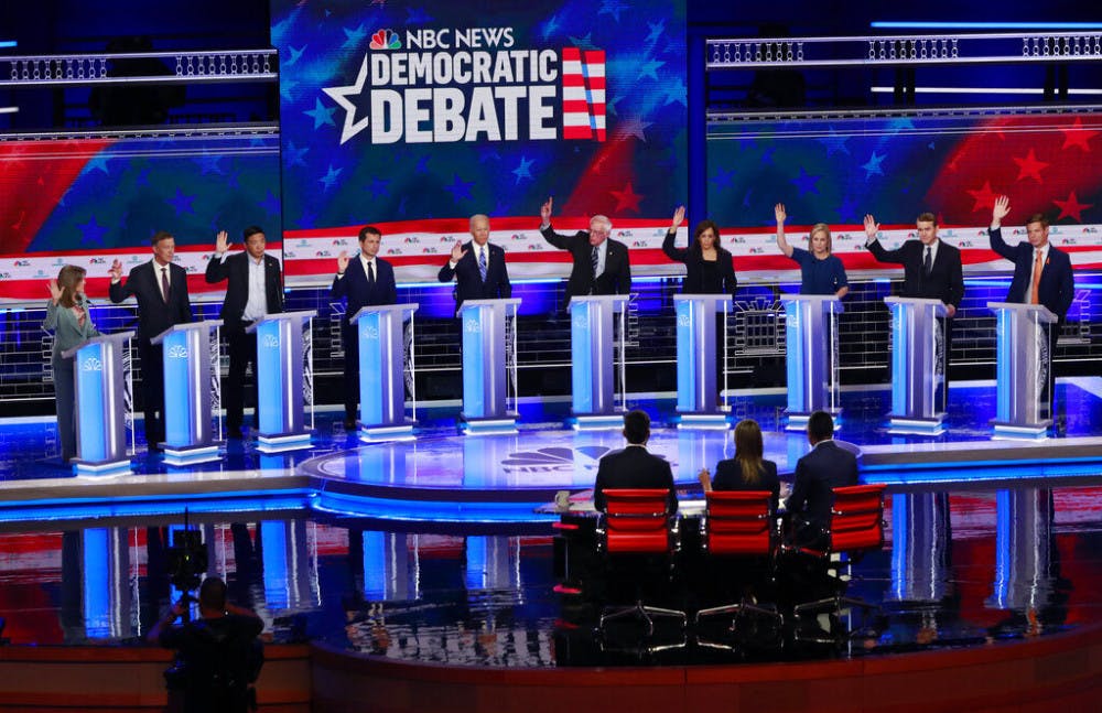 &nbsp;Democratic presidential candidates, author Marianne Williamson, former Colorado Gov. John Hickenlooper, entrepreneur Andrew Yang, South Bend Mayor Pete Buttigieg, former Vice President Joe Biden, Sen. Bernie Sanders, I-Vt., Sen. Kamala Harris, D-Calif., Sen. Kirsten Gillibrand, D-N.Y., Colorado Sen. Michael Bennet, and Rep. Eric Swalwell, D-Calif., raise their hands when asked if they would provide healthcare for undocumented immigrants, during the Democratic primary debate hosted by NBC News at the Adrienne Arsht Center for the Performing Arts, Thursday, June 27, 2019, in Miami.&nbsp;