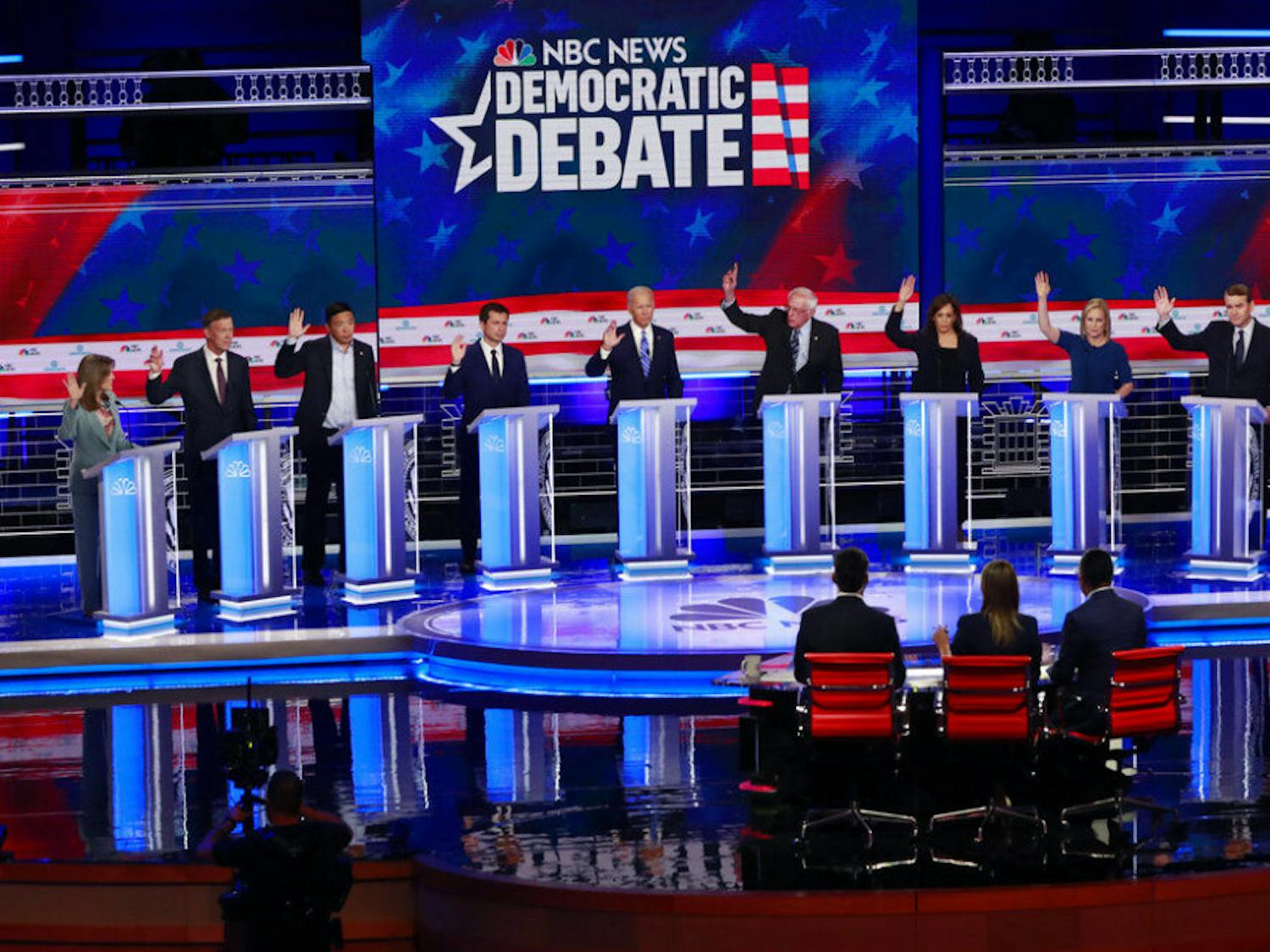 &nbsp;Democratic presidential candidates, author Marianne Williamson, former Colorado Gov. John Hickenlooper, entrepreneur Andrew Yang, South Bend Mayor Pete Buttigieg, former Vice President Joe Biden, Sen. Bernie Sanders, I-Vt., Sen. Kamala Harris, D-Calif., Sen. Kirsten Gillibrand, D-N.Y., Colorado Sen. Michael Bennet, and Rep. Eric Swalwell, D-Calif., raise their hands when asked if they would provide healthcare for undocumented immigrants, during the Democratic primary debate hosted by NBC News at the Adrienne Arsht Center for the Performing Arts, Thursday, June 27, 2019, in Miami.&nbsp;