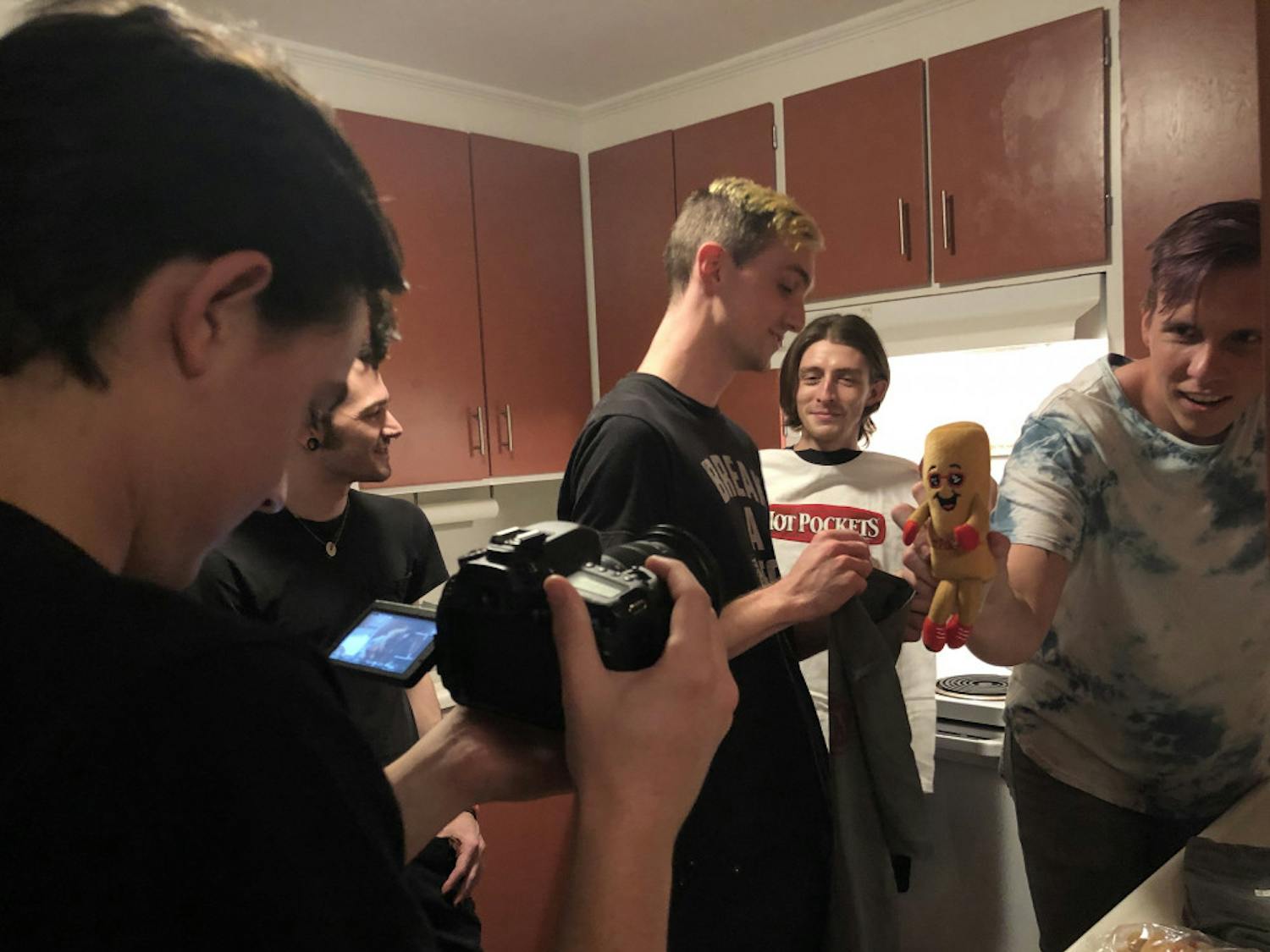 Behind the scenes of Arrows in Action’s Hot Pockets unboxing video. The band’s manager, Jacob McKay, films bassist Tony Farah, guitarist Matt Fowler, lead vocalist Victor Viramontes-Pattison and drummer Jesse Frimmel (from left to right).
