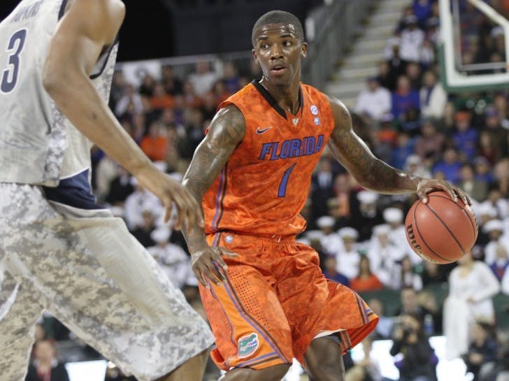 Florida guard Kenny Boynton brings the ball up the floor during Friday’s game against&nbsp; Georgetown aboard the USS Bataan in Jacksonville.&nbsp;
