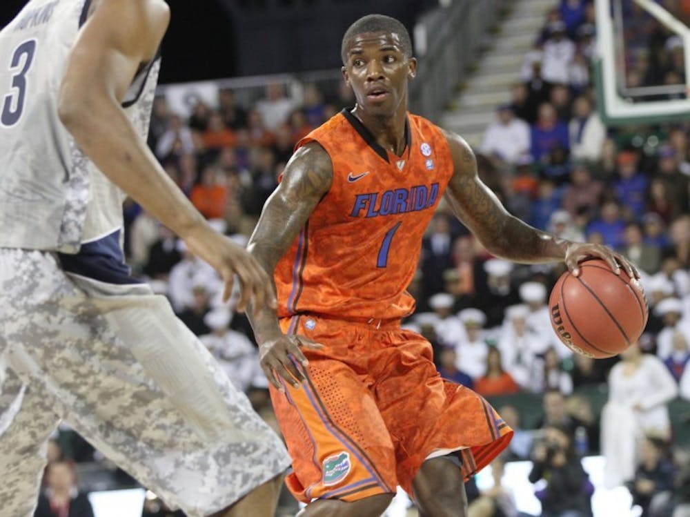 <p><span>Florida guard Kenny Boynton brings the ball up the floor during Friday’s game against&nbsp; Georgetown aboard the USS Bataan in Jacksonville.&nbsp;</span></p>
<div><span><br /></span></div>