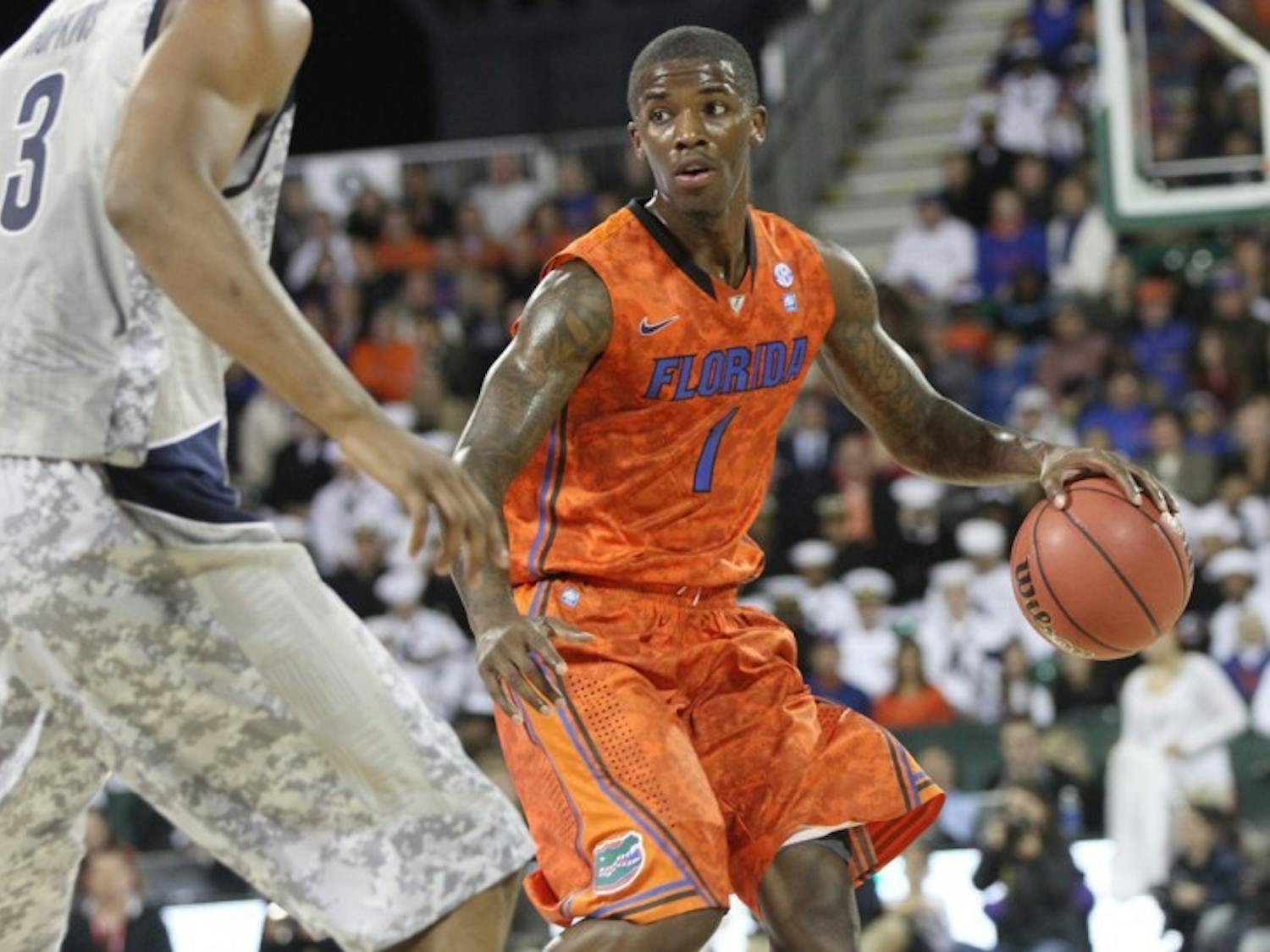 Florida guard Kenny Boynton brings the ball up the floor during Friday’s game against Georgetown aboard the USS Bataan in Jacksonville. 