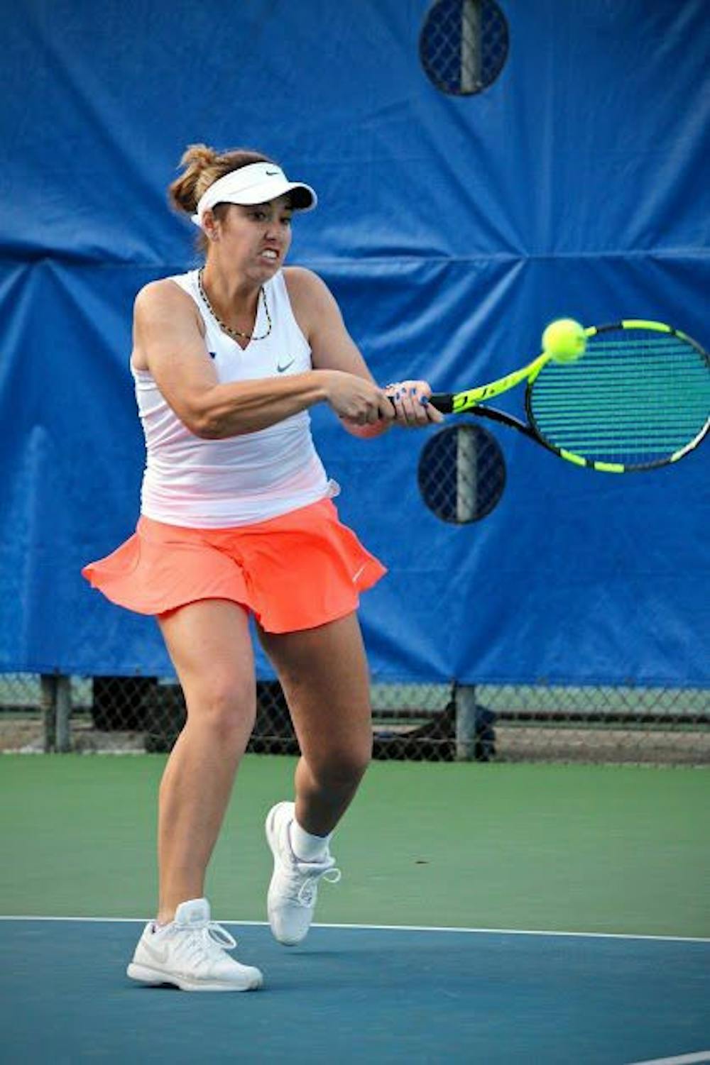 <p>UF's Brooke Austin hits a backhand during Florida's 4-2 win against Oklahoma State on Feb. 18, 2017, at the Ring Tennis Complex.</p>