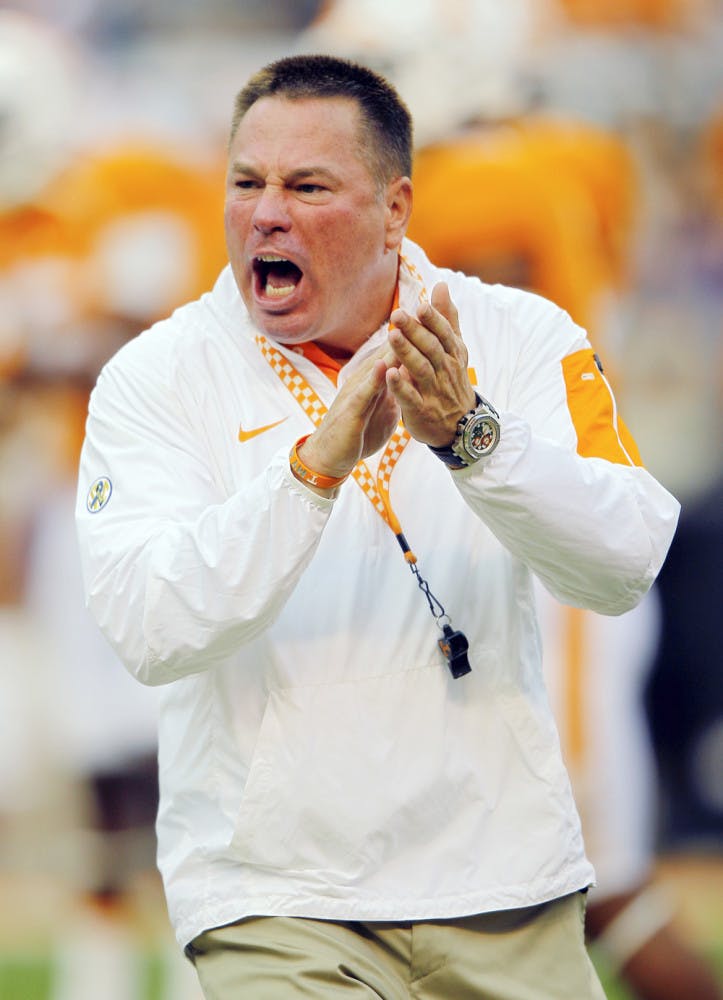 Tennessee head coach Butch Jones yells to his players during warmups before an NCAA college football game against Western Carolina, Saturday, Sept. 19, 2015, in Knoxville, Tenn.