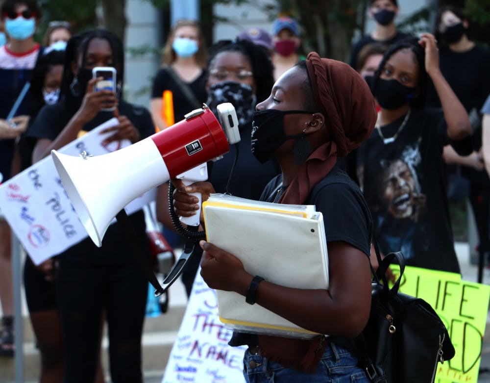 Photo of a protest organizer at a protest on racial injustice