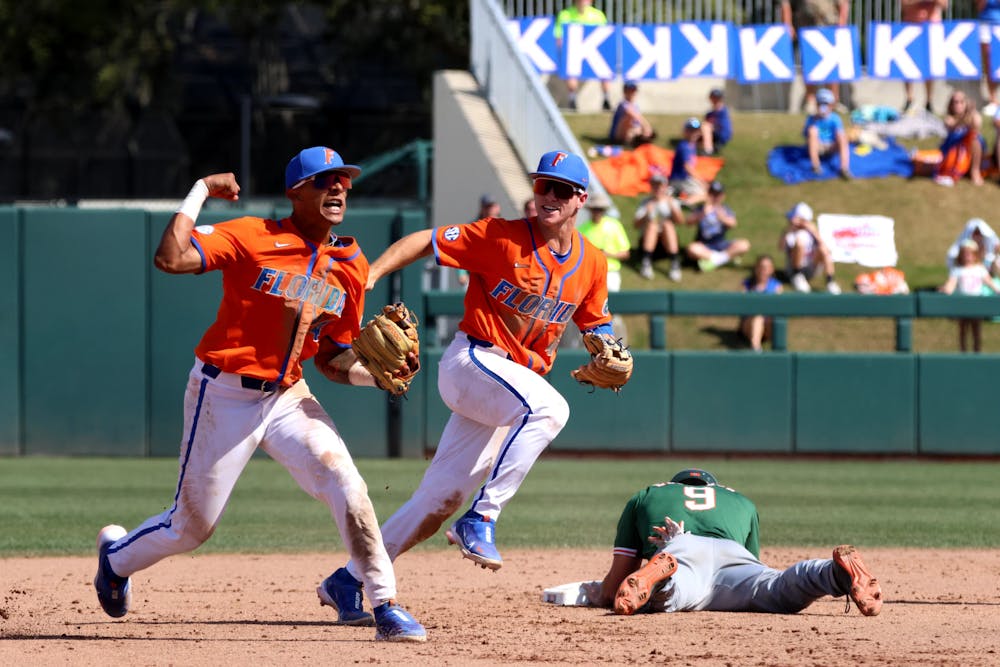 UF junior shortstop Josh Rivera celebrates turning a double play to end the top of the eighth inning of No. 6 Florida’s 14-4 mercy-rule win against the No. 22 Miami Hurricanes at Condron Ballpark Sunday, March 5, 2023.