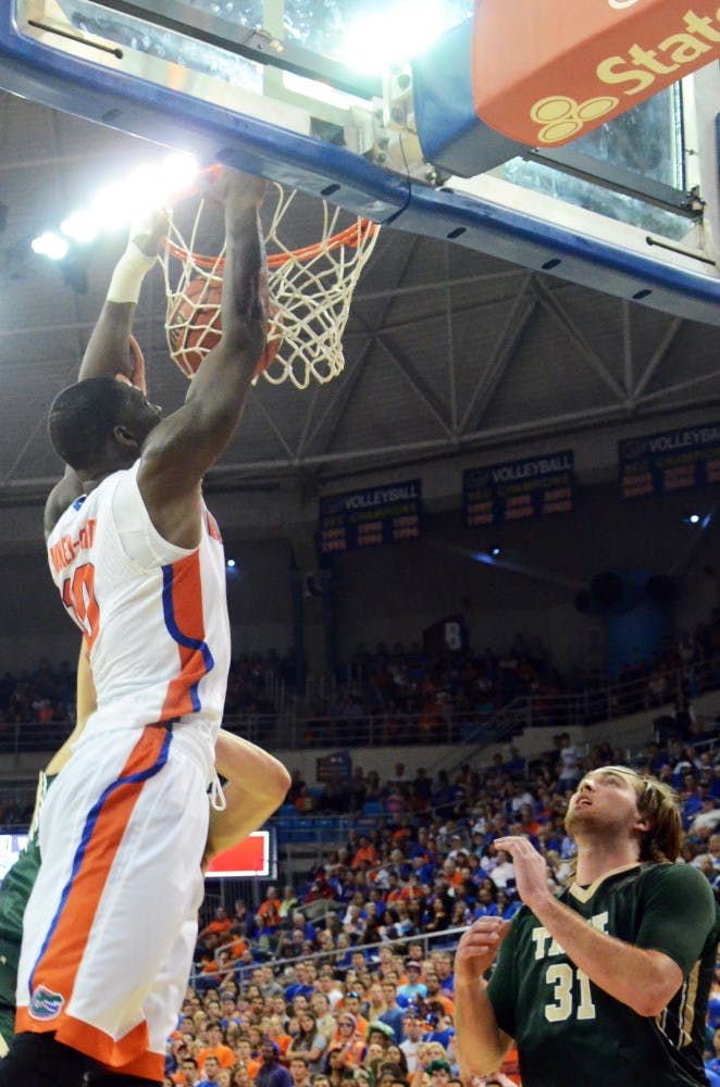 Dorian Finney-Smith dunks during Florida's season-opening win against William &amp; Mary on Friday in the O'Connell Center.