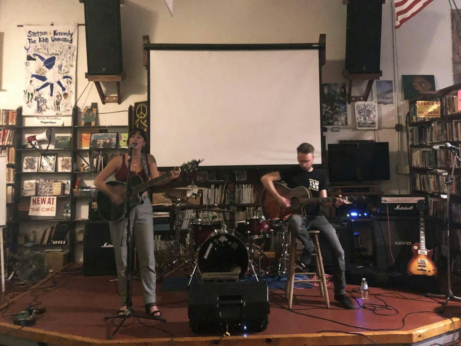 Charlene Joan (left) plays at the Civic Media Center on Sunday accompanied by guitarist Josh Gigantelli (right).