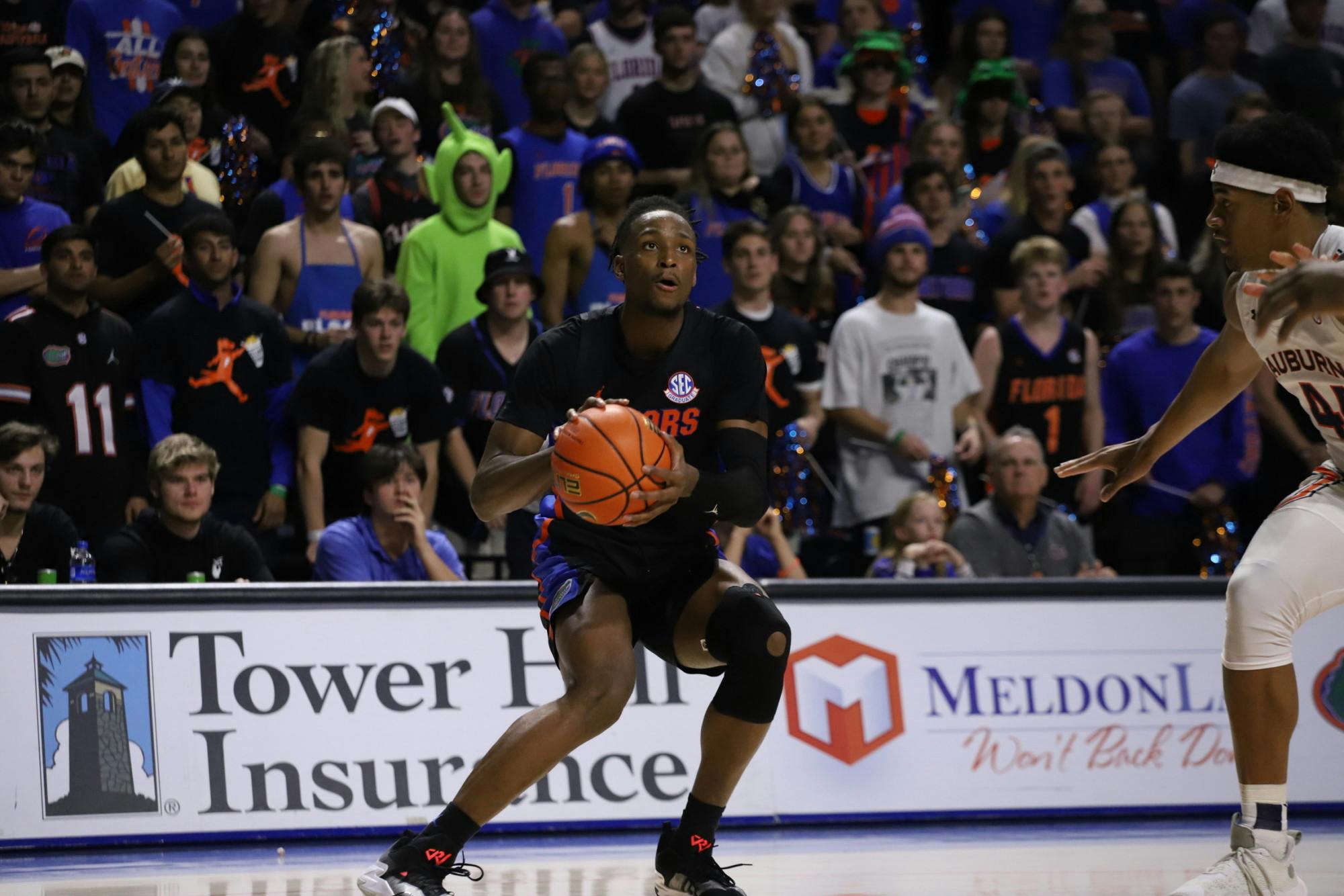 Graduate transfer Phlandrous Fleming Jr. loads up a jump shot against Auburn Feb. 19. Fleming had a clutch block and 3-point make down the stretch Tuesday against Vanderbilt. 
